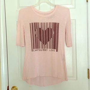 “Can’t Buy My Love” soft pink loose fitting shirt.